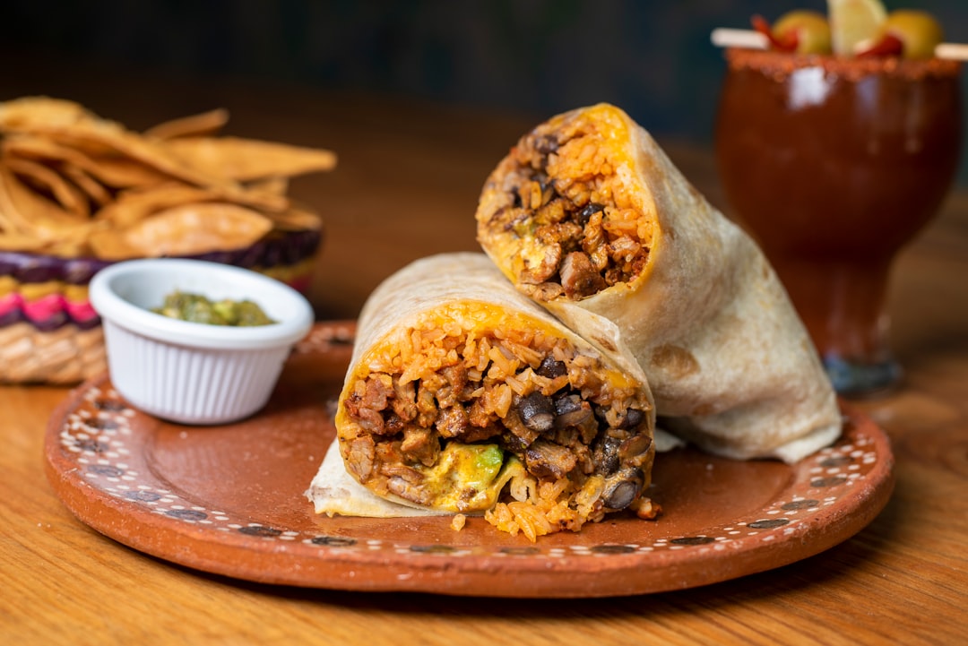 a-burrito-cut-in-half-on-a-plate-bqv9zodio6a