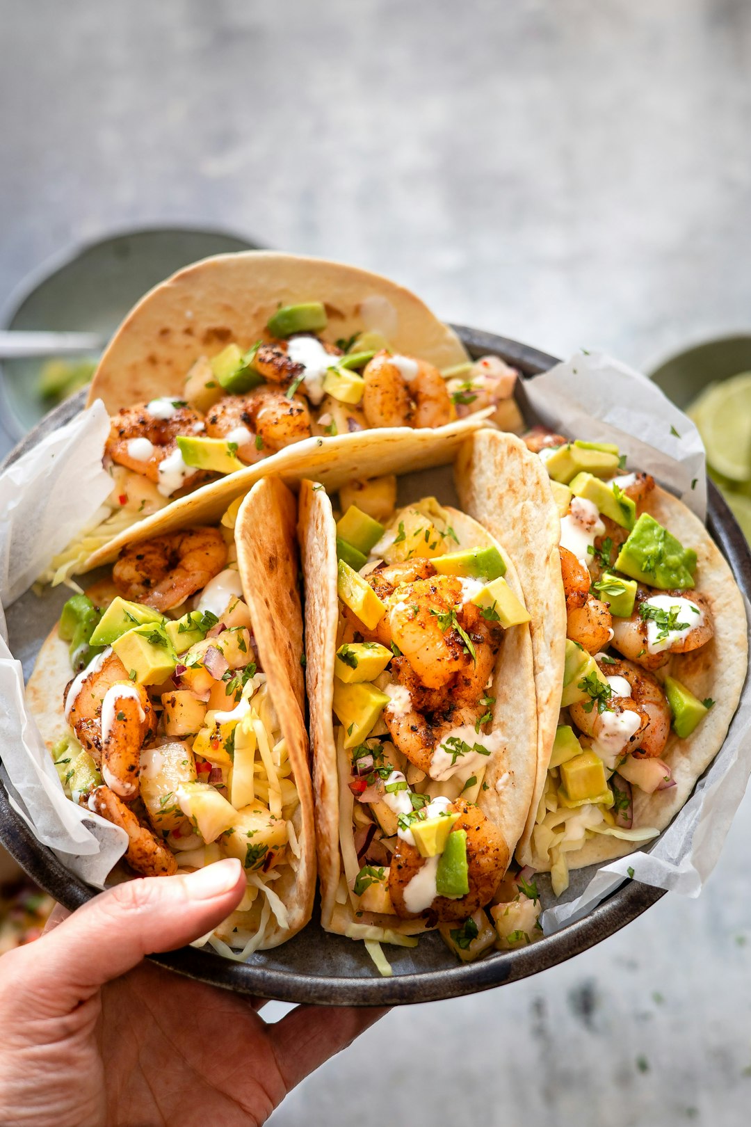 Prawn tacos with avocado and lime crema.