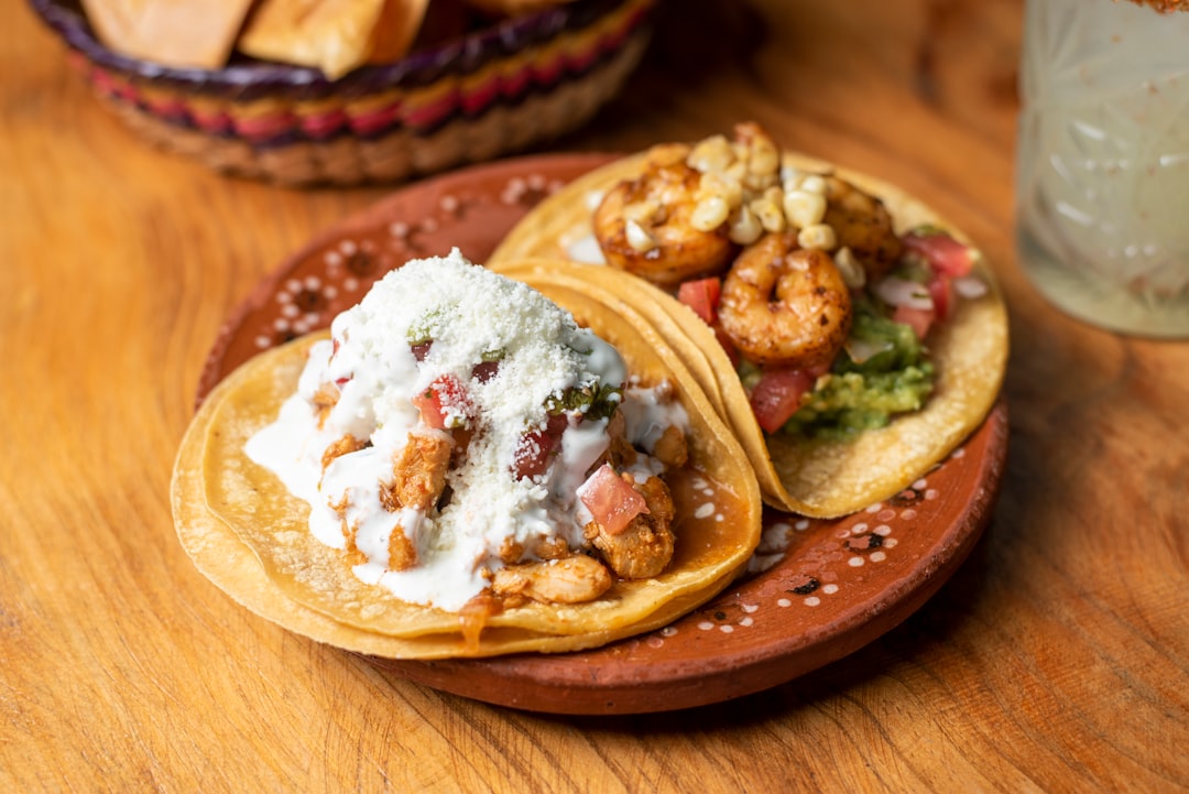 three-tacos-on-a-plate-on-a-table-yilxxy1hfea